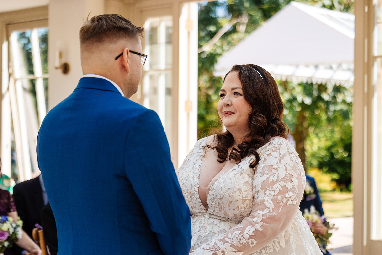 A bride looking into the eyes of her groom on her wedding day