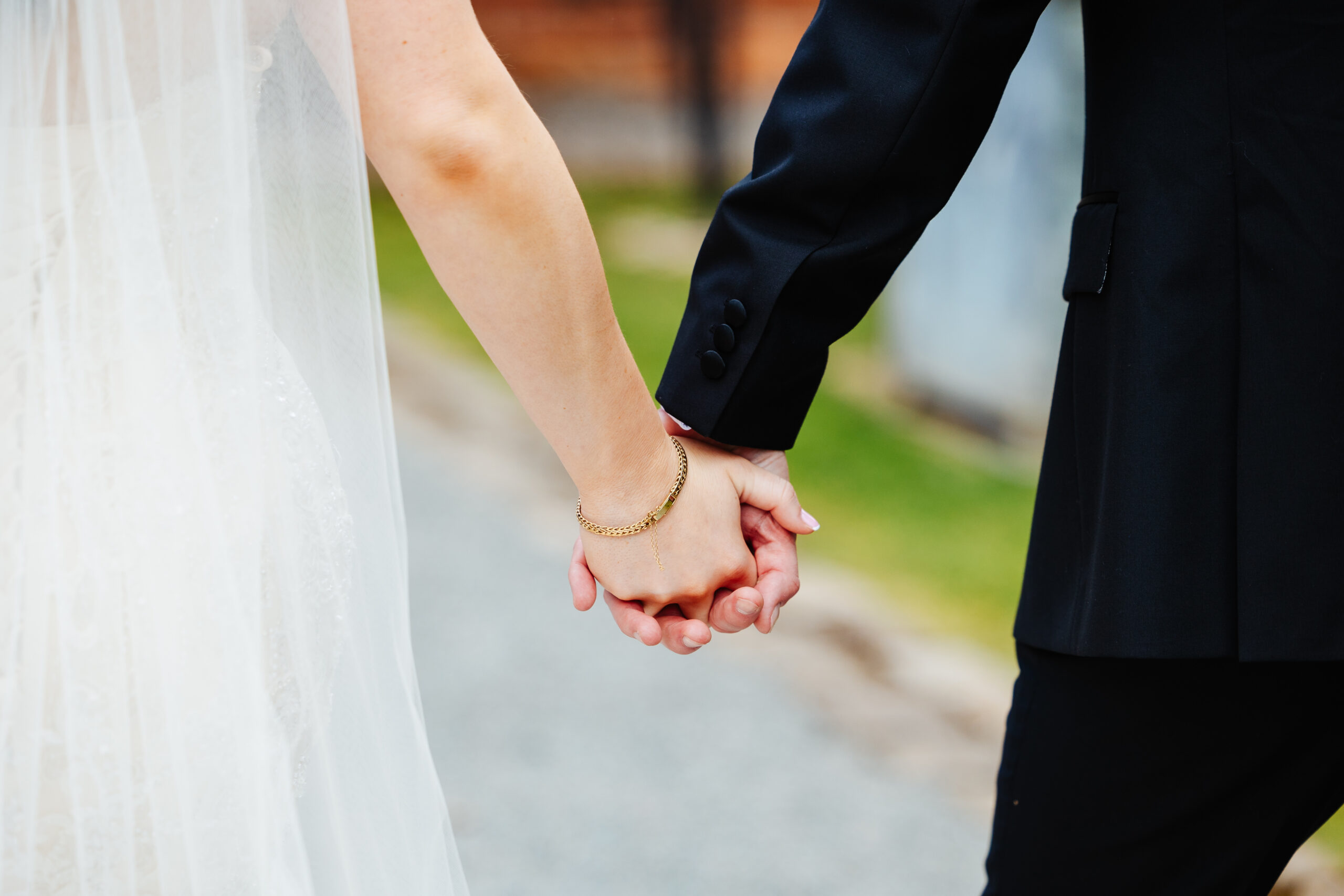 A photo of the bride and groom's hands.