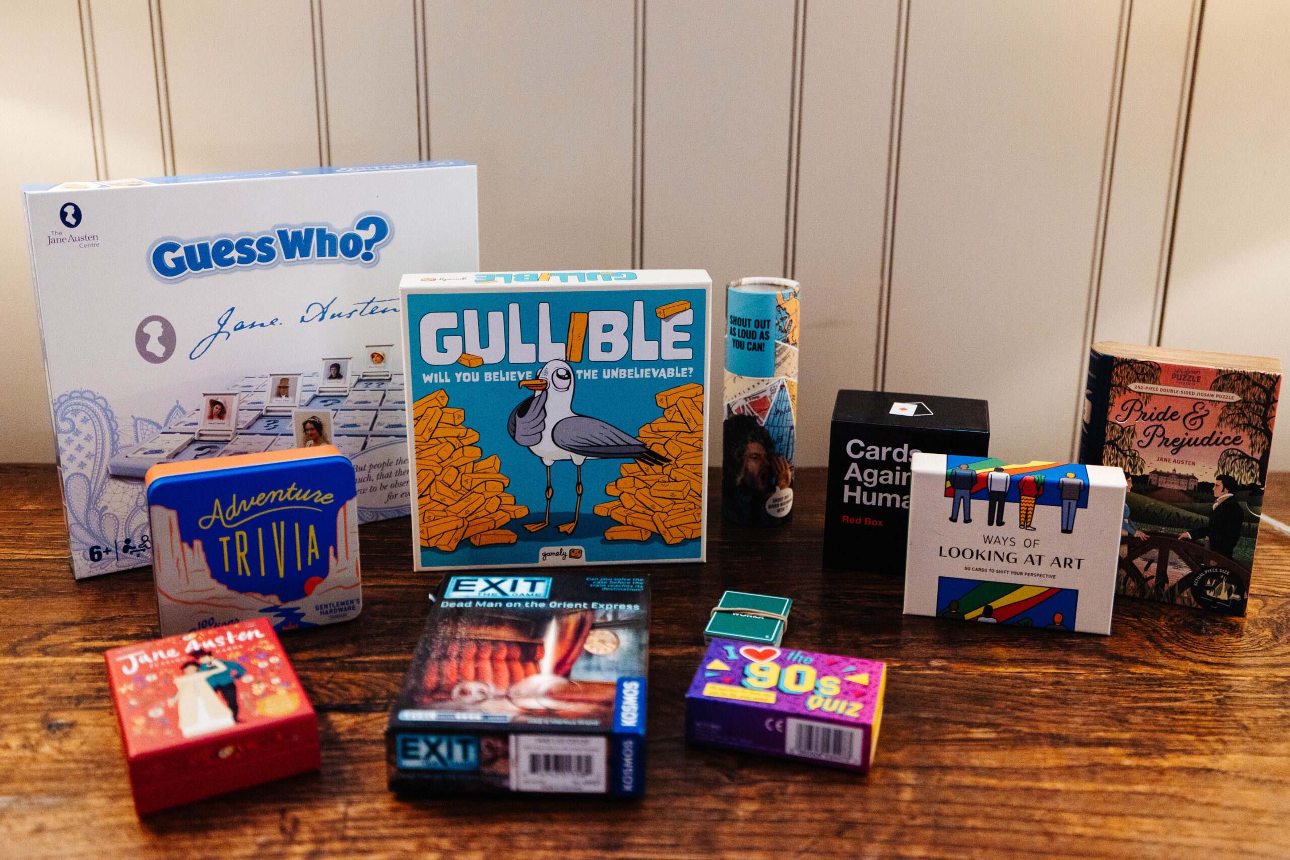 A selection of board games on a wooden table