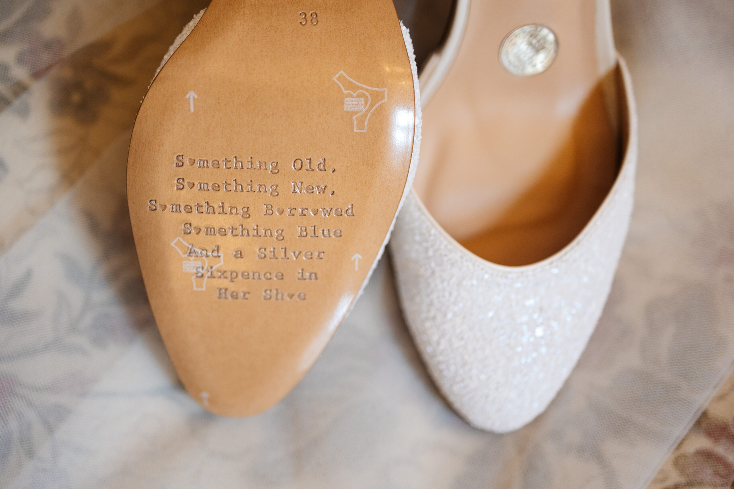 The sole of the bride's shoes. It has "something old, something new, something borrowed, something blue and a sixpence in her shoe"
The other shoe has a sixpence in it.