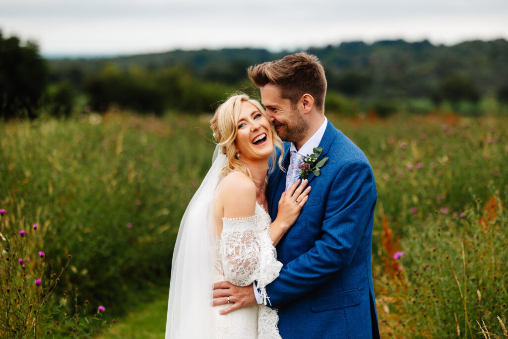 reckless barn paddocks bride and groom cuddling