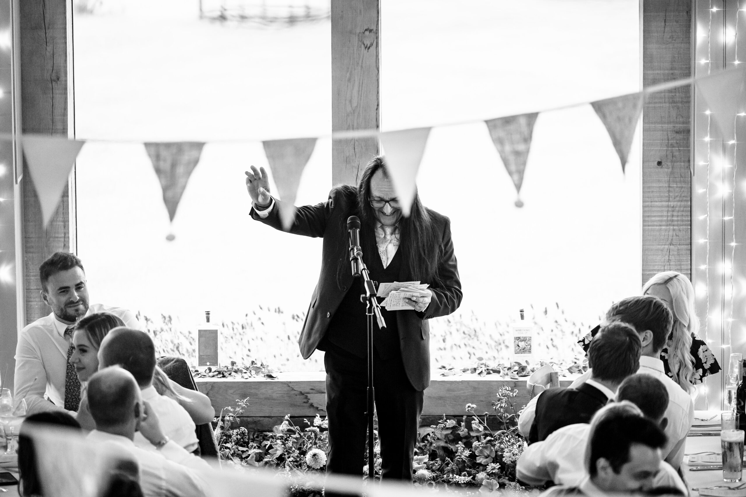 A black and white image of a man giving a speech.