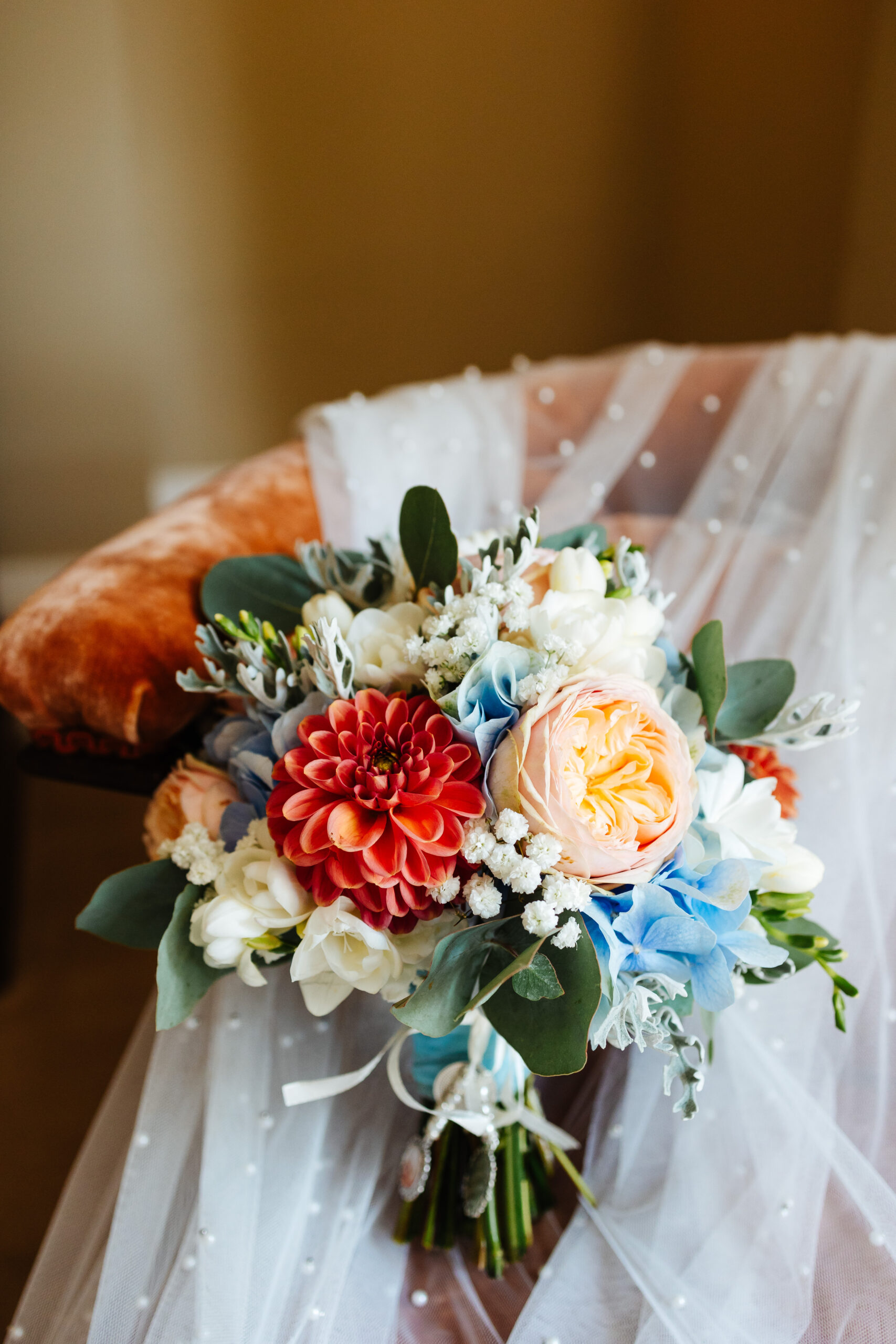 A beautiful bouquet of flowers including dahlias and peonies. 