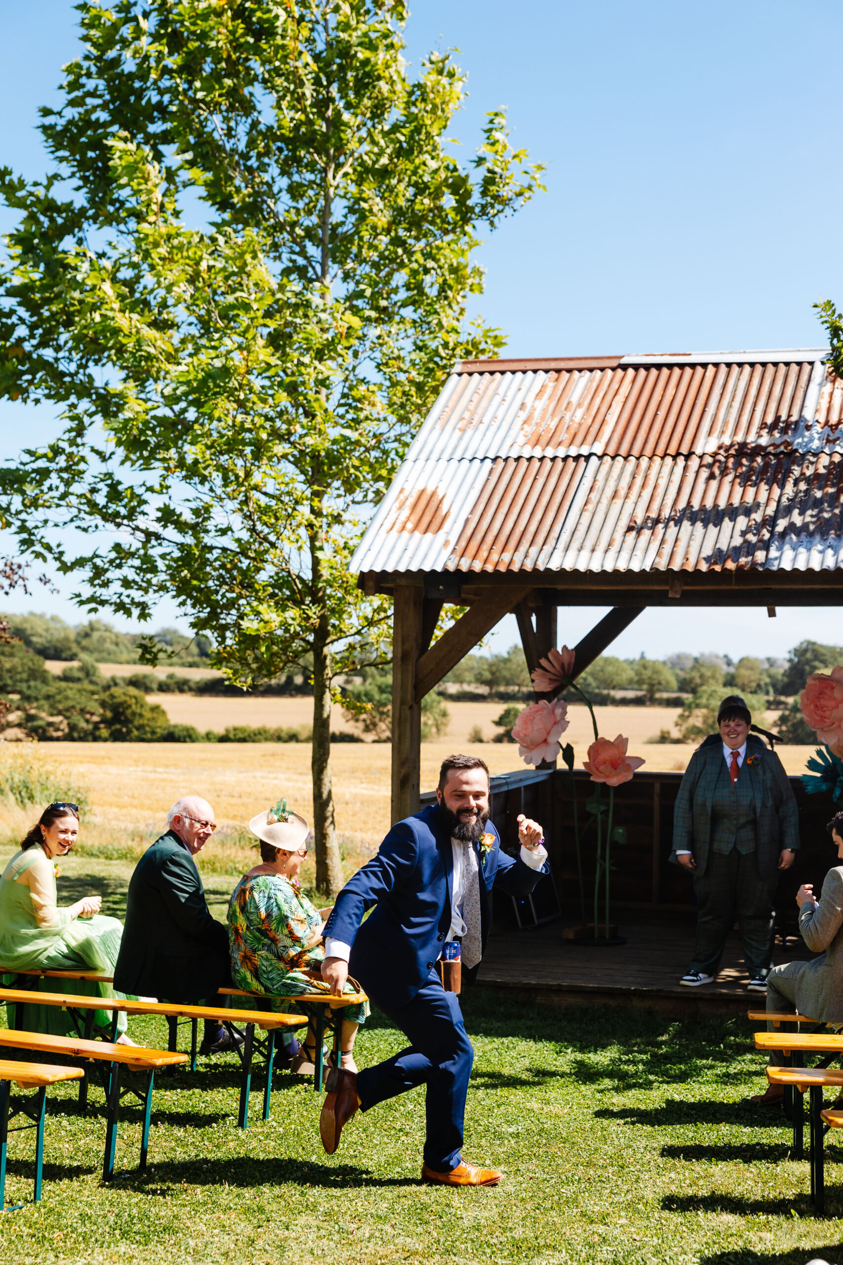 A picture of the "flower man" as he dances down the aisle.