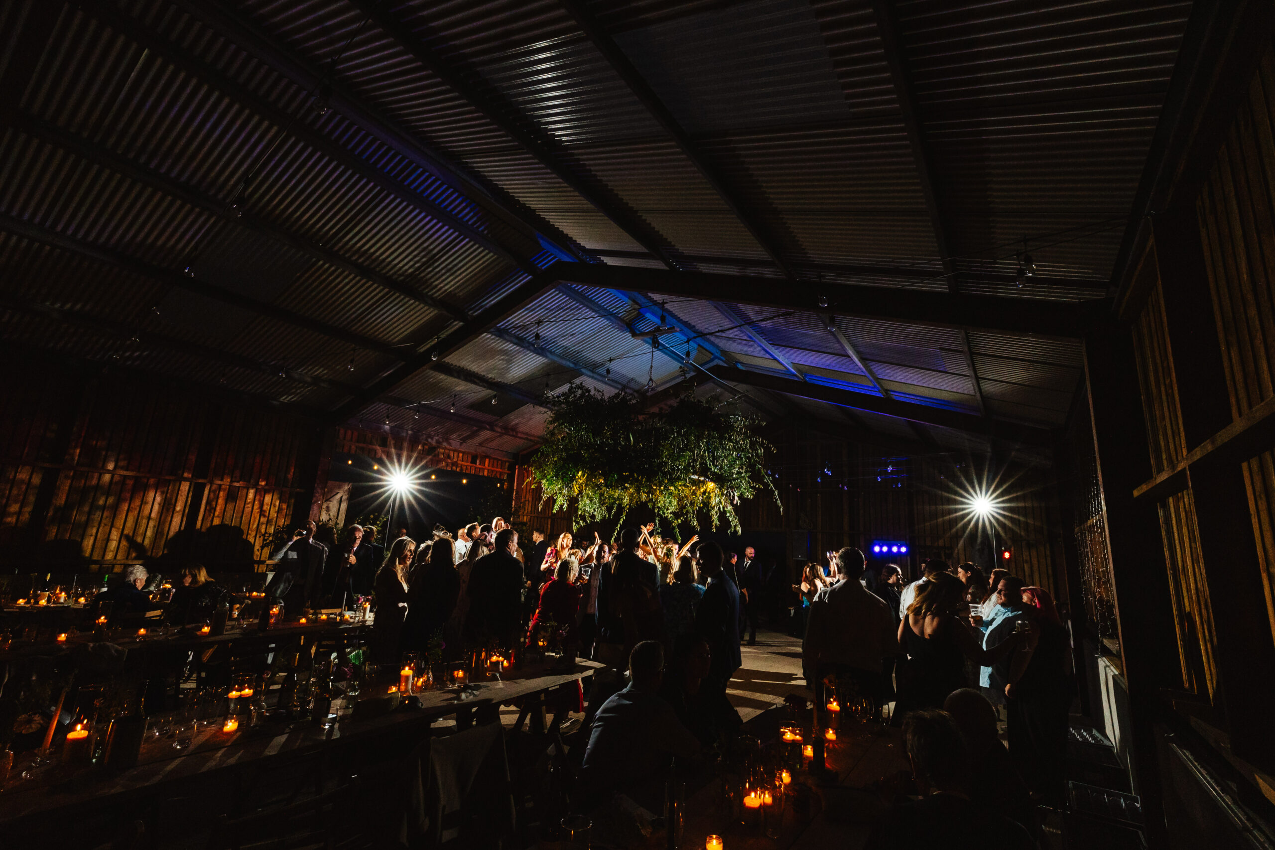 A full dance floor in the barn! You can see lots of guests in the background enjoying themselves.